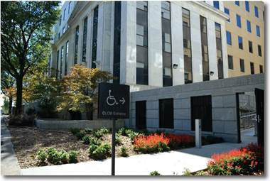 A sign pointing to an accessible entrance at the Paul D. Coverdell building.